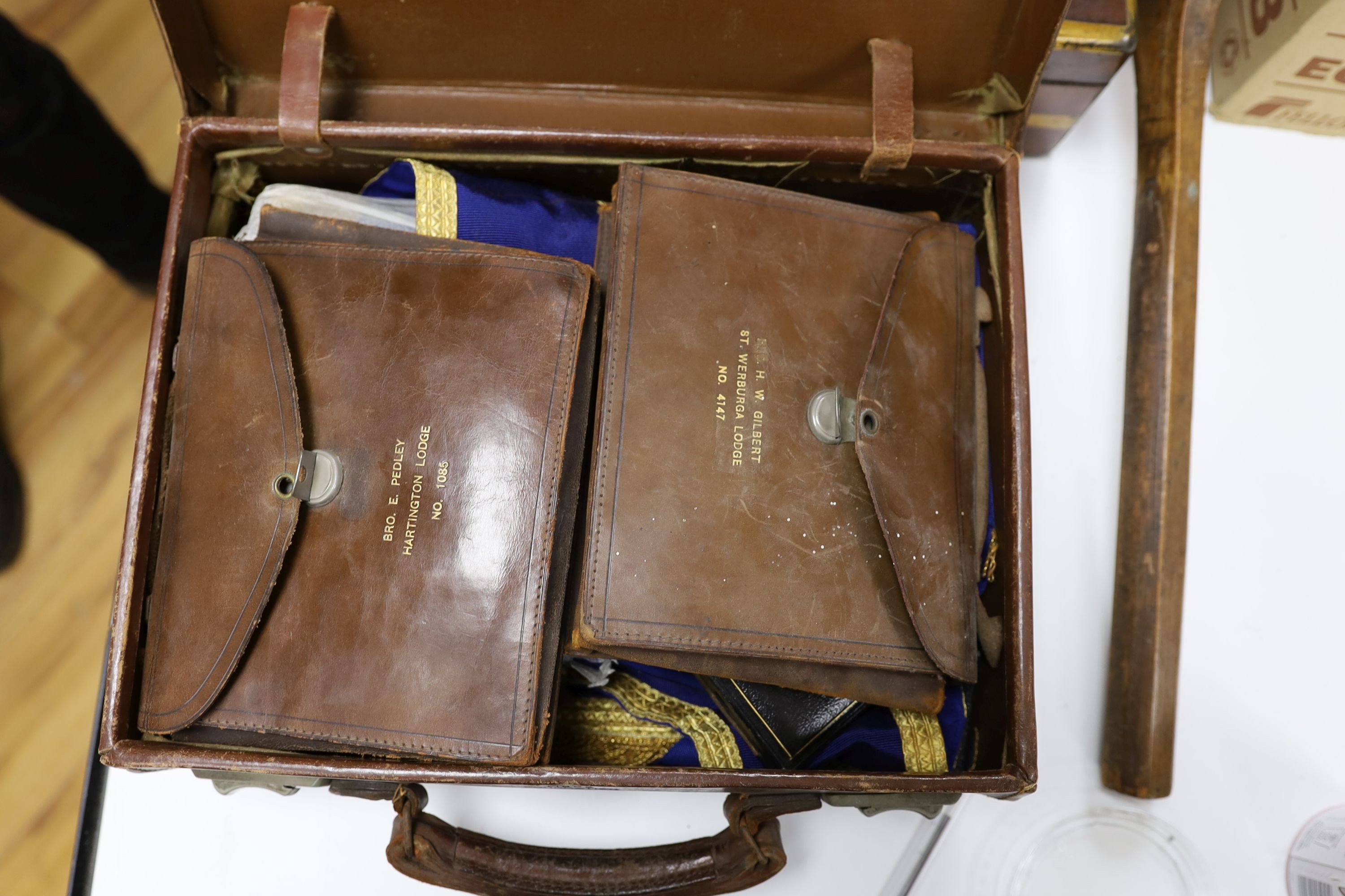 A brass bound writing slope, two small cases of Masonic Regalia and an antique tennis racquet